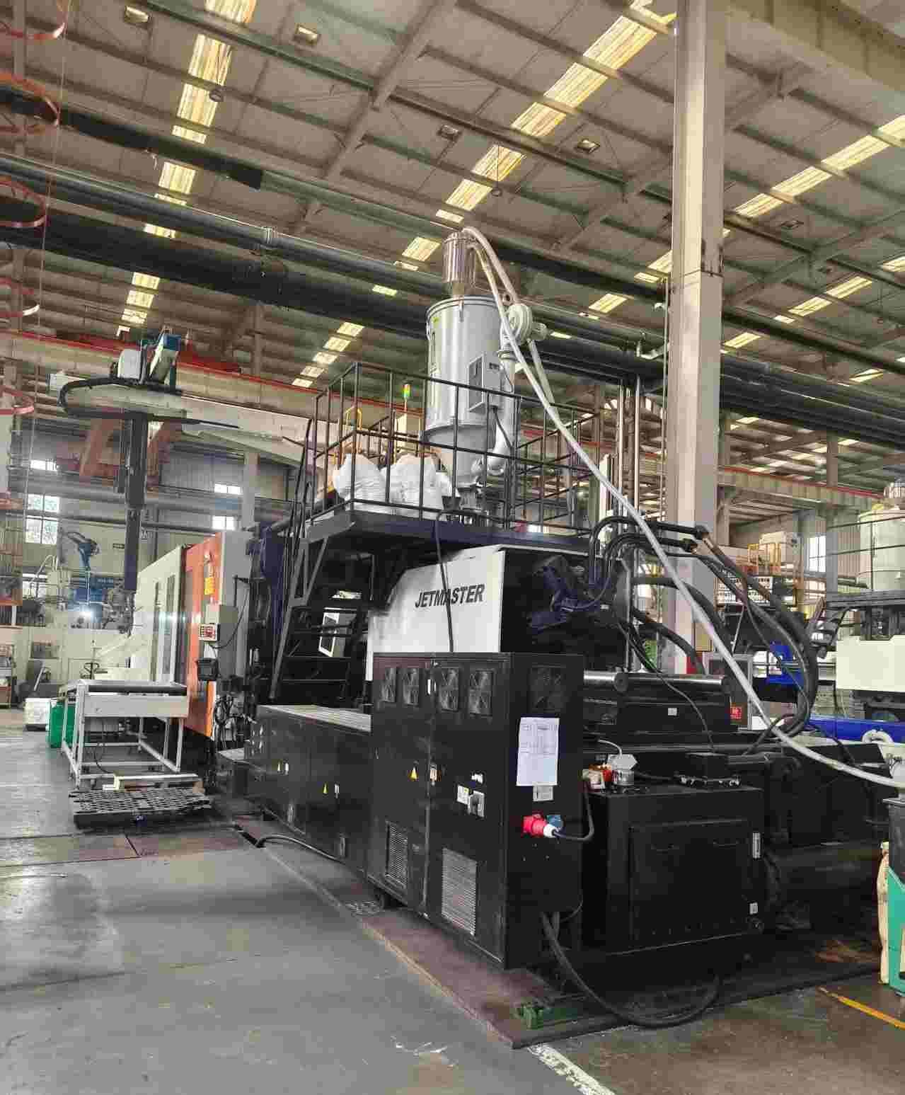 Automated precision injection molding with robotic arm for pet hardware