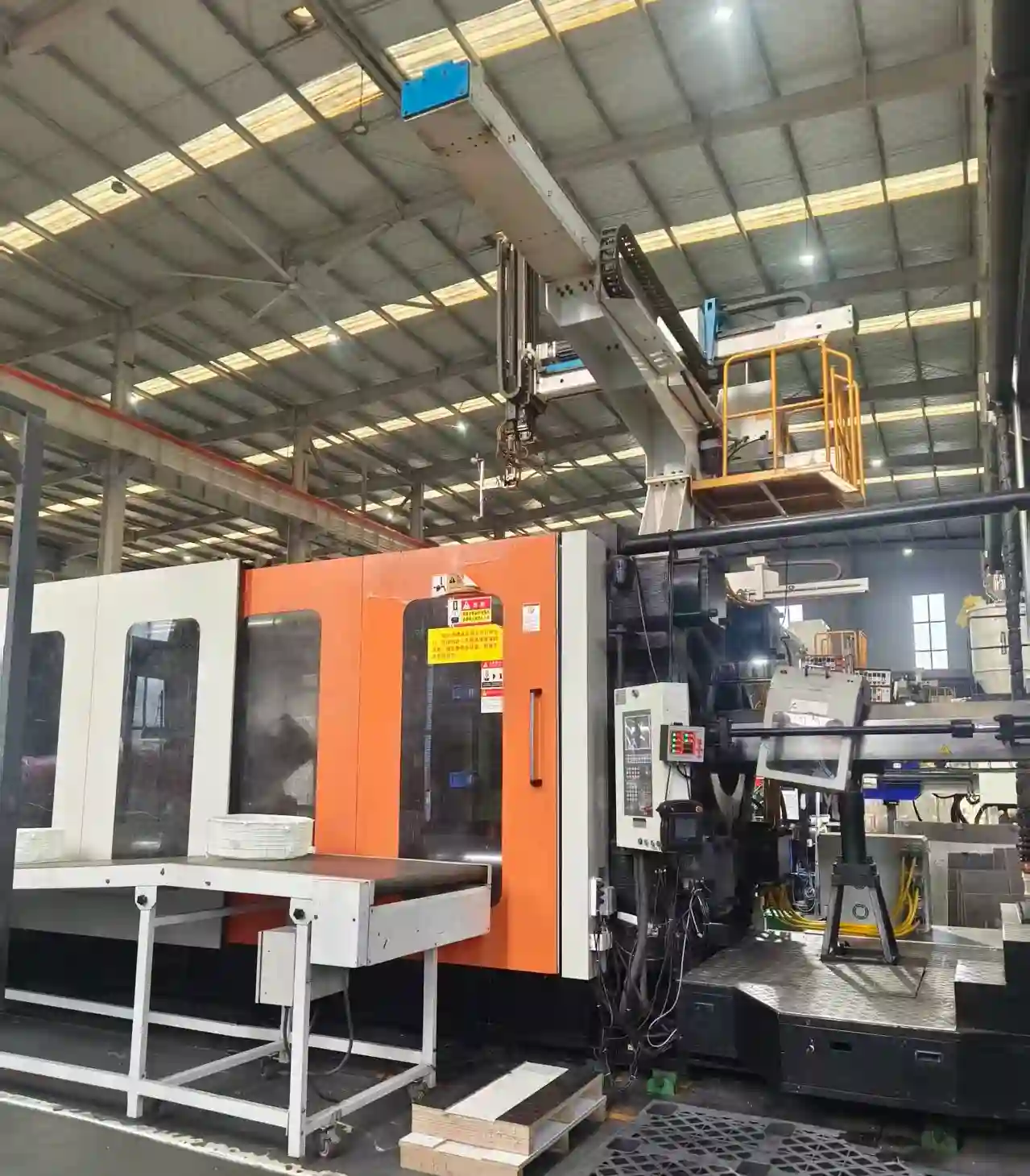 Clean pet hardware assembly line with automated robotic testing